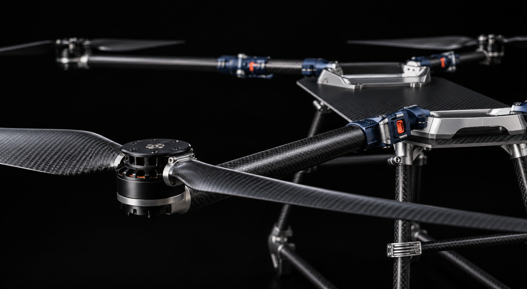 AXICOR carbon-fiber arm, motor and navy folding joint photographed against darkness with shallow depth of field